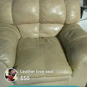 Beige leather love seat